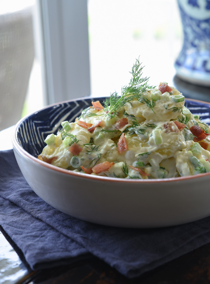 Tender potato chunks, crisp bacon, fresh dill, and creamy dressing makes this potato salad the best of its kind.