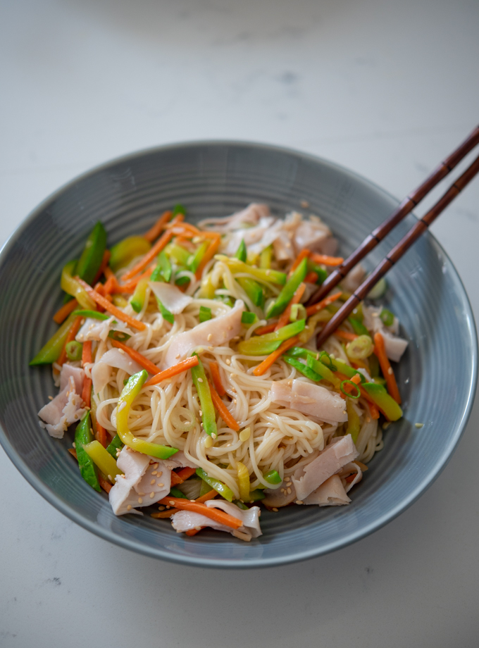 Simple wheat noodles cooked together with ham and vegetables as one pot meal.