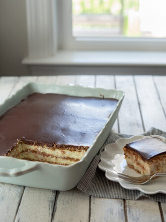 No-bake eclair cake made from scratch with graham crackers, vanilla custard, and chocolate ganache