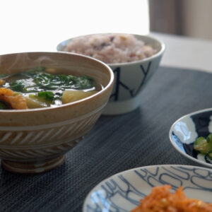 This quick Korean soup with arugula and potato is flavored with dried pollock fish and Korean soybean paste.