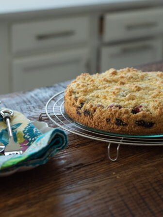 Buttery crisp crumb cake is layered with a moist berry filling
