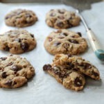 Brown butter chocolate chip cookies showing chewy texture inside.
