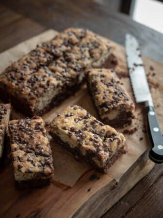 Black bottom banana cake baked with mini chocolate chip is sliced into bars.
