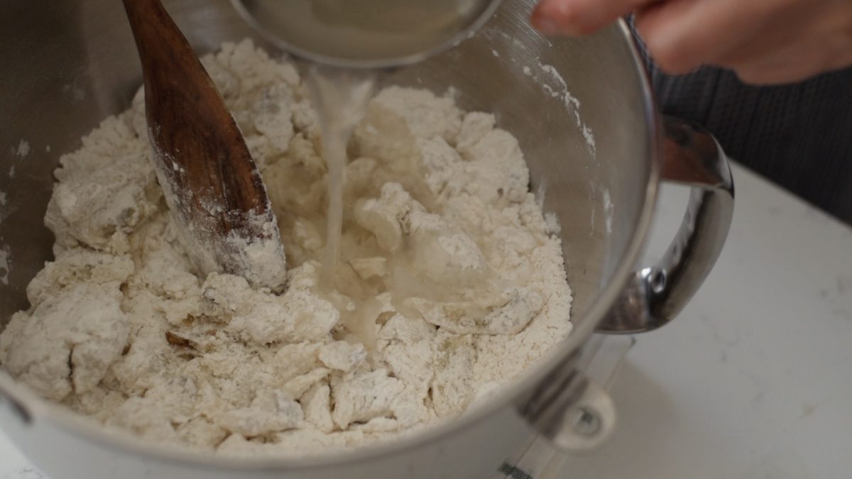 Flour mixture and the reserved potato liquid is added to the mashed potato.