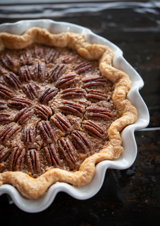 This Southern pecan pie is decorated with pecan halves on top