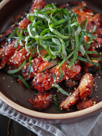 Chicken bulgogi made with Korean chili paste (gochujang) is garnished perilla leaves