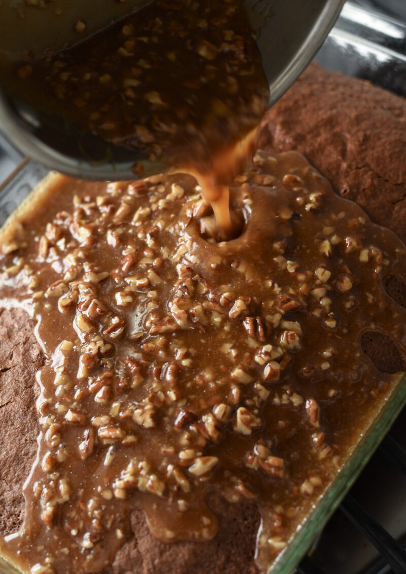 Pour the pecan caramel topping over the chocolate oatmeal cake