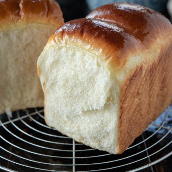 This soft and feathery Asian milk bread is made easily without Tangzhong method.