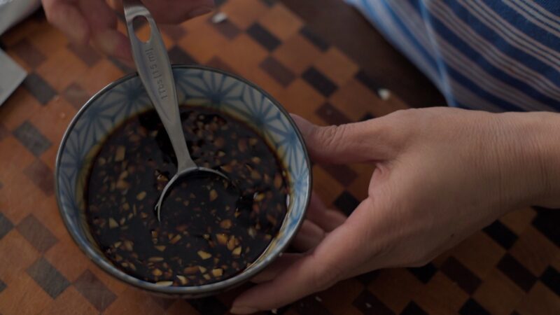 Honey garlic sauce is mixed in a bowl.