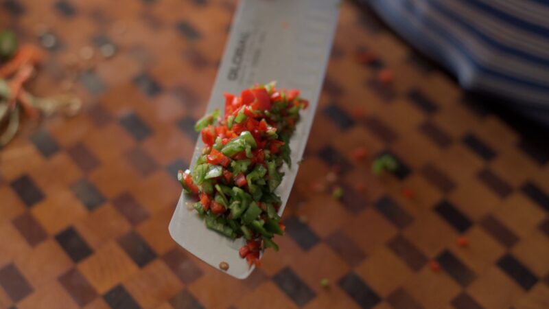 Fresh red and green chili are finely minced.