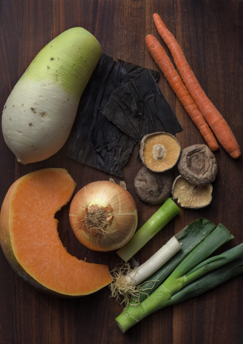 Various vegetables, mushroom and dried sea kelp are gathered and displayed together.