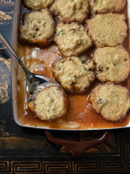 soft date dumplings are nestled in sweet brown sugar syrup