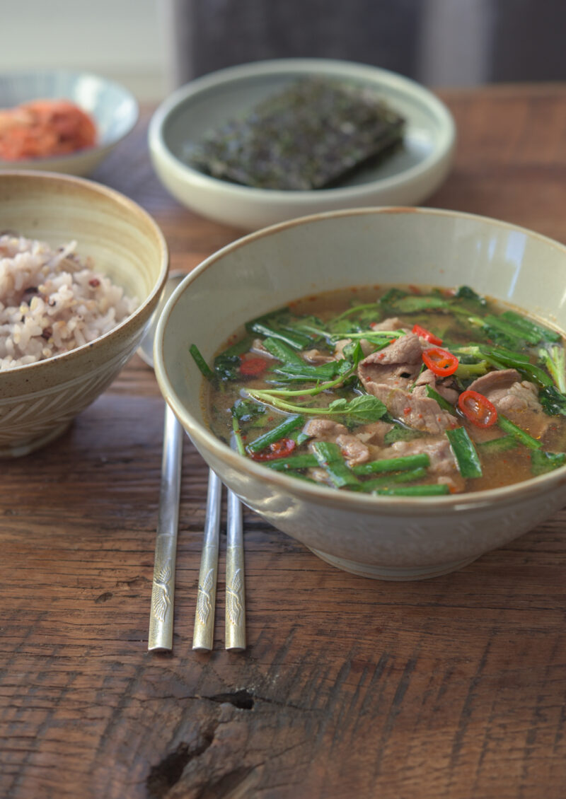 This Korean beef and wtercress soybean paste soup (doenjang guk) is served with rice and kimchi.