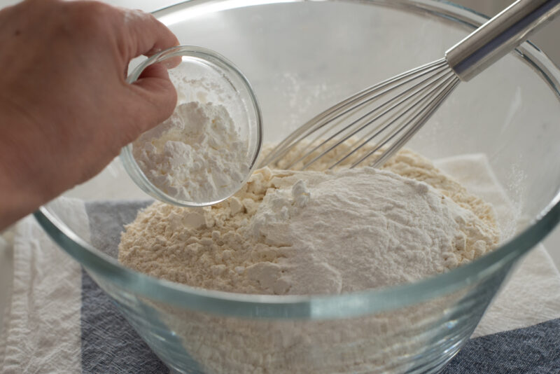 To make dumpling dough, mix flour, sweet rice flour and cornstarch in a bowl 