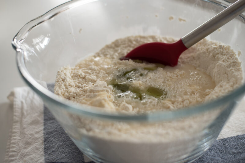 Oil and water is added to the flour mixture to make a dumpling dough.