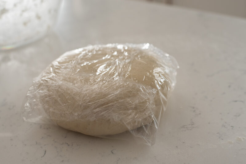 Dumpling dough wrapped in a plastic wrap.
