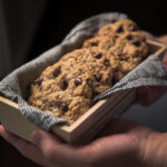 Holding chocolate chip wheat germ cookies in the box on hand