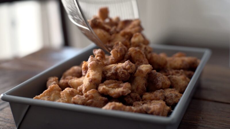 Korean chicken nuggets are deep-fried to golden brown and crisp.