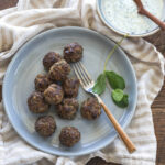 Middle eastern matballs are served in mint yogurt dip