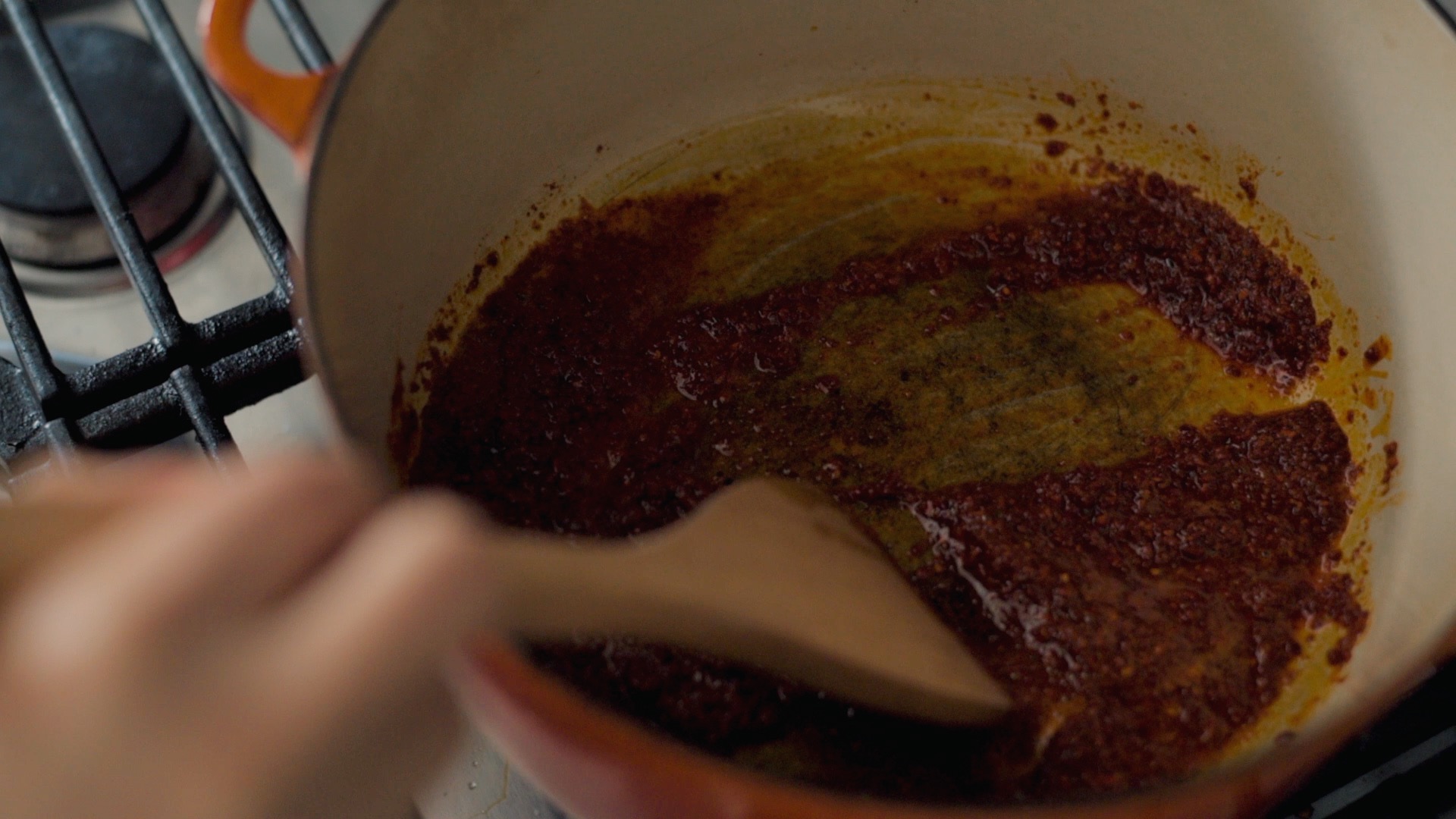 Blooming Korean chili flakes (gochugaru) in hot oil to make chili oil for yukgaejang