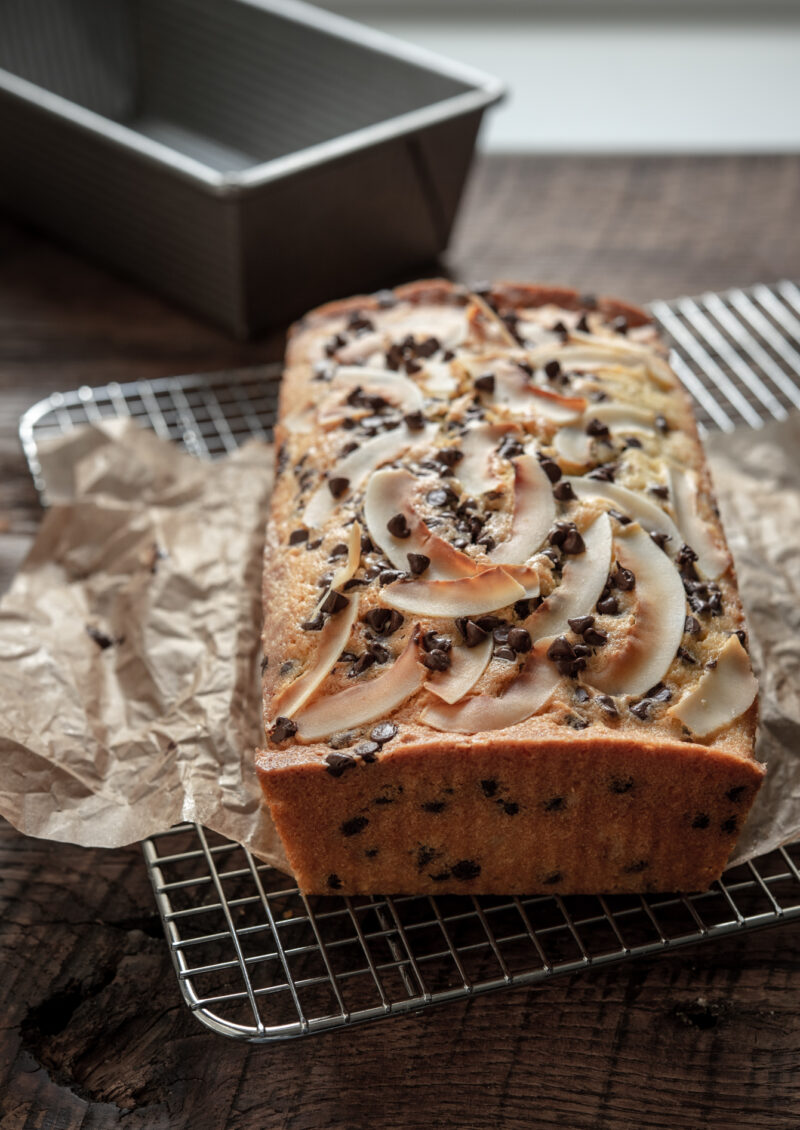 Coconut chocolate chip cake is baked in a loaf pan.