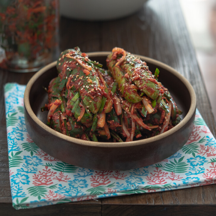 Traditional cucumber kimchi (Oi-Sobagi) is stuffed with Asian chives, carrot, onion, Korean chili filling