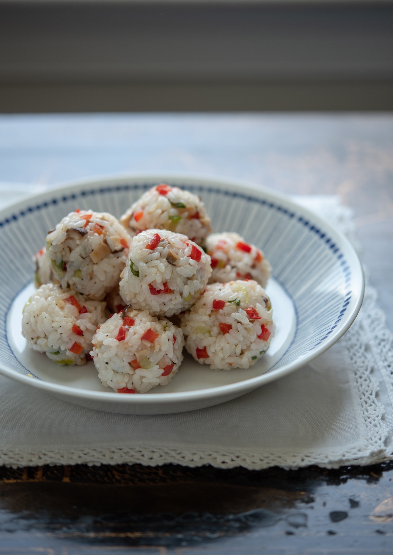 Mushroom and vegetable rice balls on a serving dish.