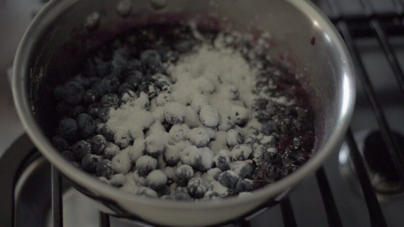 Tapioca starch is added to the boiling filling in a pot.