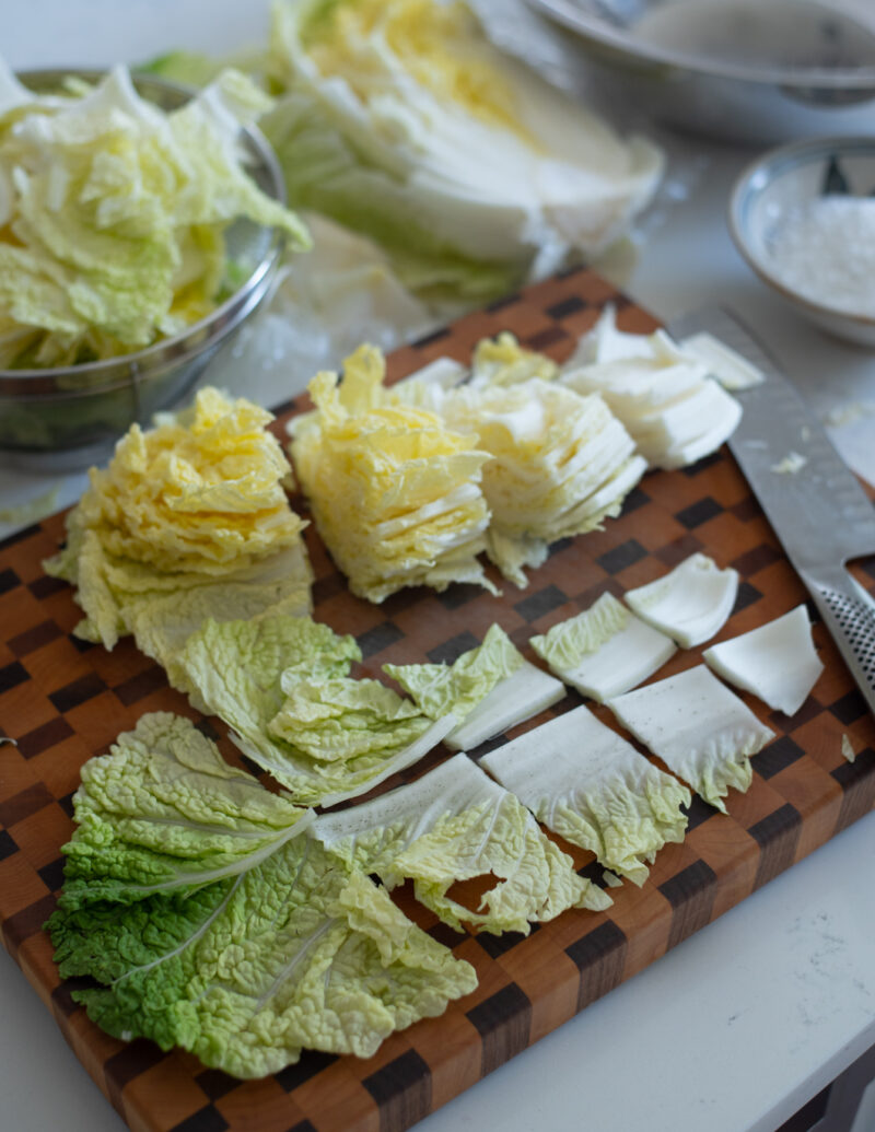 cabbage leaves are diced into sections on the cutting board.
