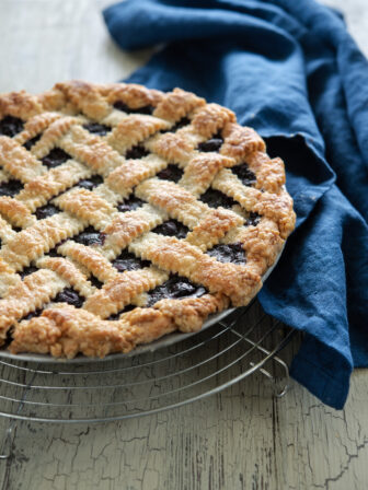 Maple blueberry pie is baked in a light and flaky lard and butter pie crust.