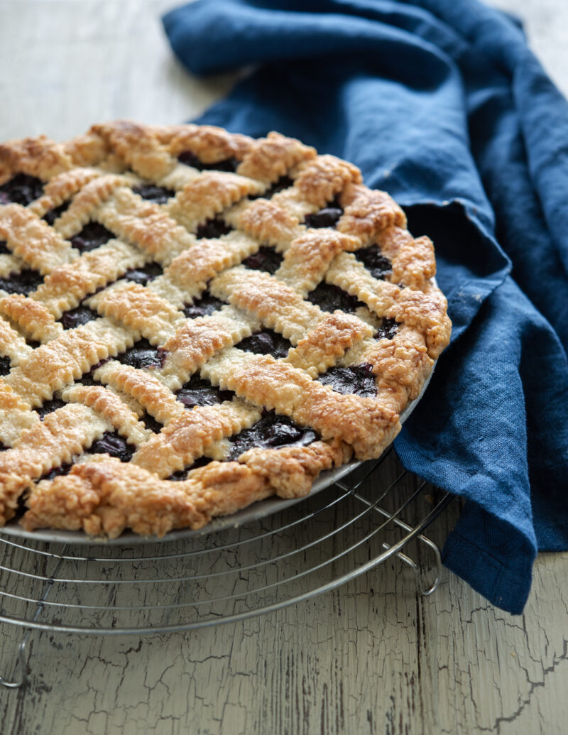 Maple blueberry pie is baked in a light and flaky lard and butter pie crust.