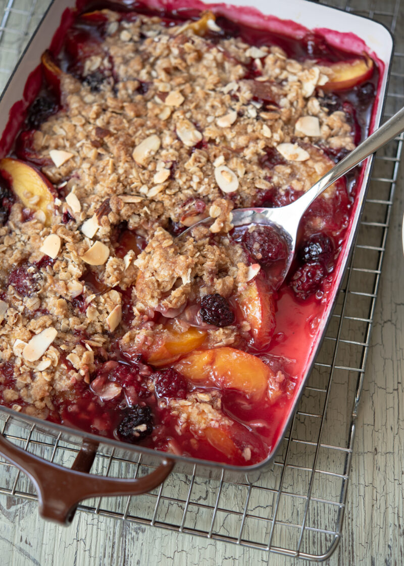 Nectarine and blackberry are baked together with crunchy oat topping 
