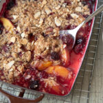 Nectarine and blackberry are baked together with crunchy oat topping