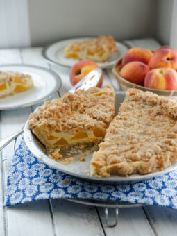 Peach and creamy custard makes a tasty pie, especially with the streusel topping