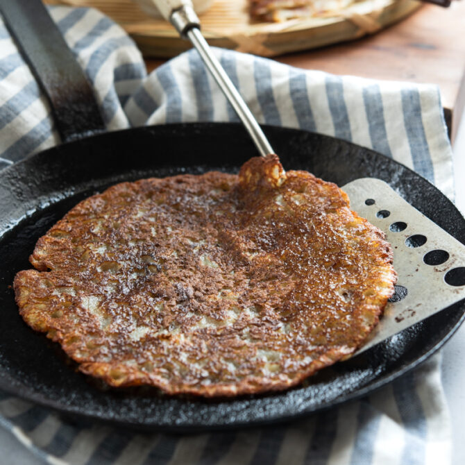 Korean potato pancakes are pan-fried to golden crisp in a skillet