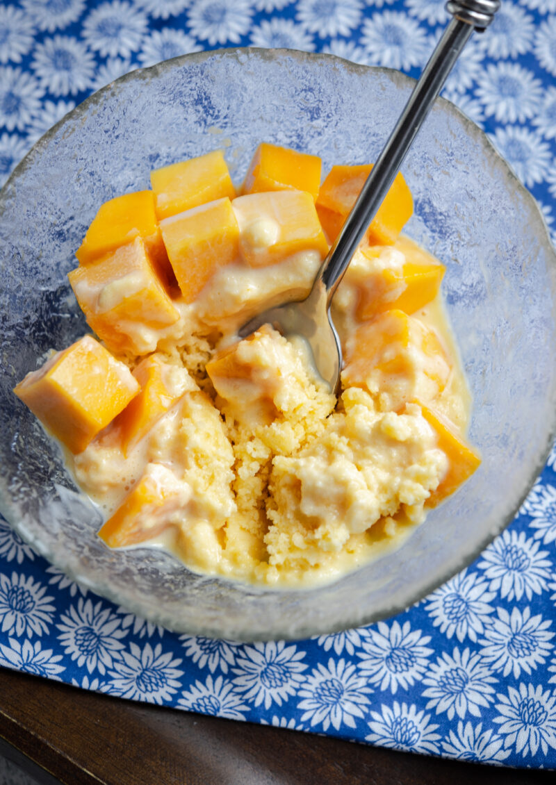 Cool and refreshing shaved ice dessert is topped with mango pieces