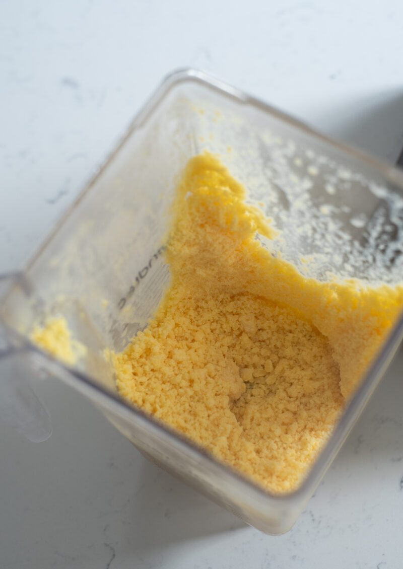 Mango ice processed in a blender to make coarse shave ice crumbs
