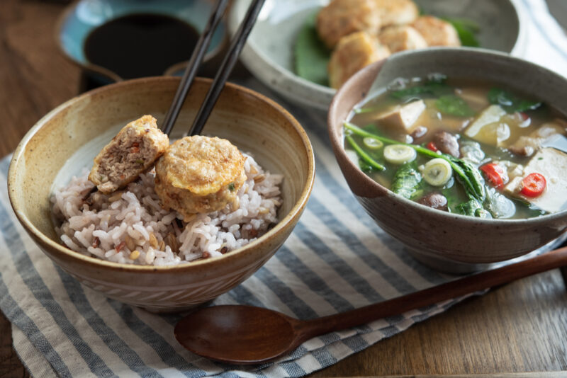Korean meat patties are served with rice and spinach doenjang soup on the side.