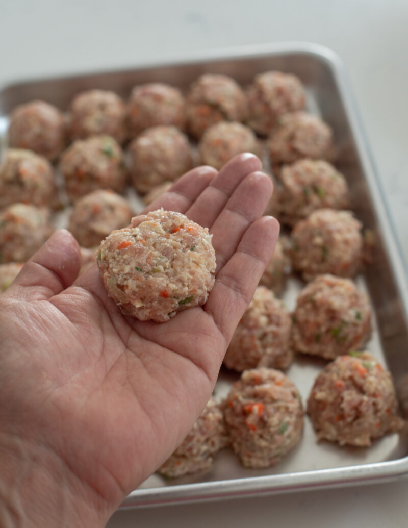 Each mat tofu patties are flattened slightly by hand 