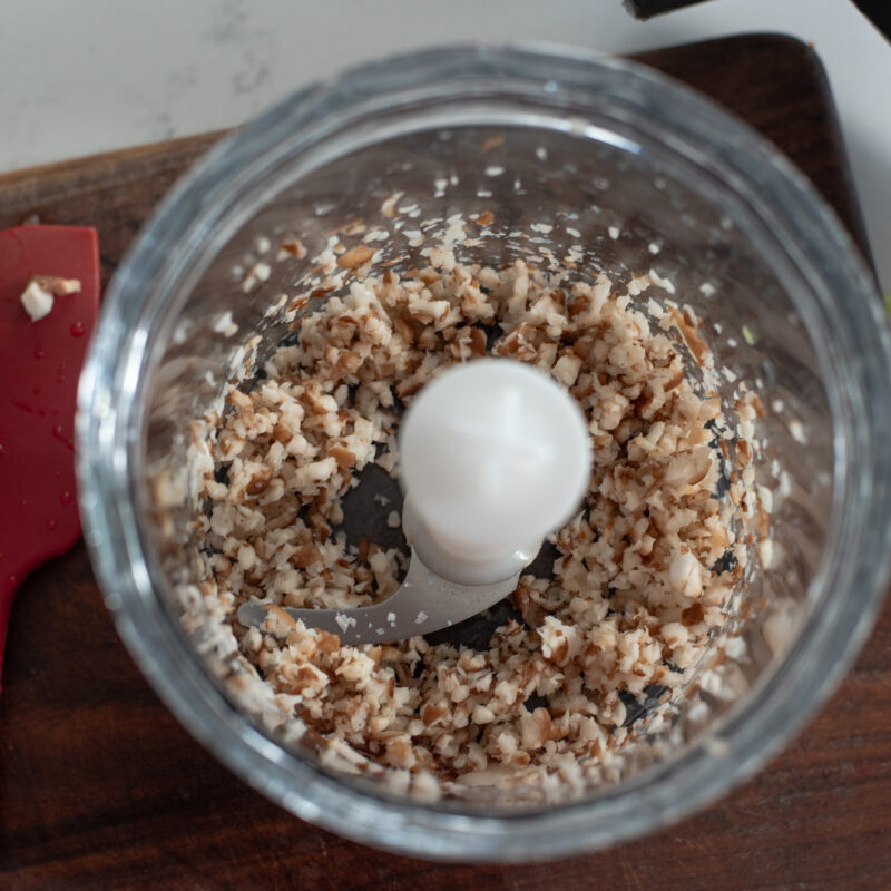 Shiitake mushroom is finely chopped in a mini food processor.