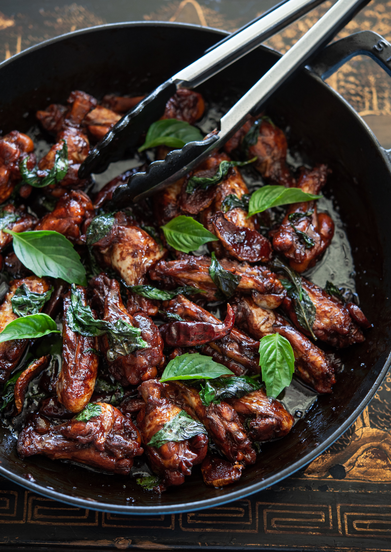 Three Cup Chicken (San Bei Ji) topped with fresh Thai basil leaves