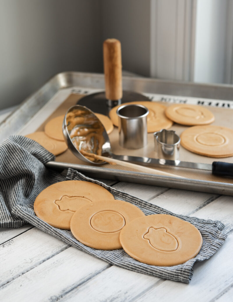 Korean Dalgona candies are pressed with different patterns of cookie cutters.