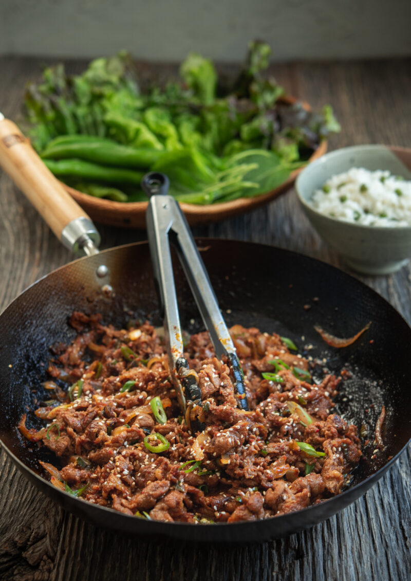 Stir-fried spicy Korean pork goes well with rice and lettuce.