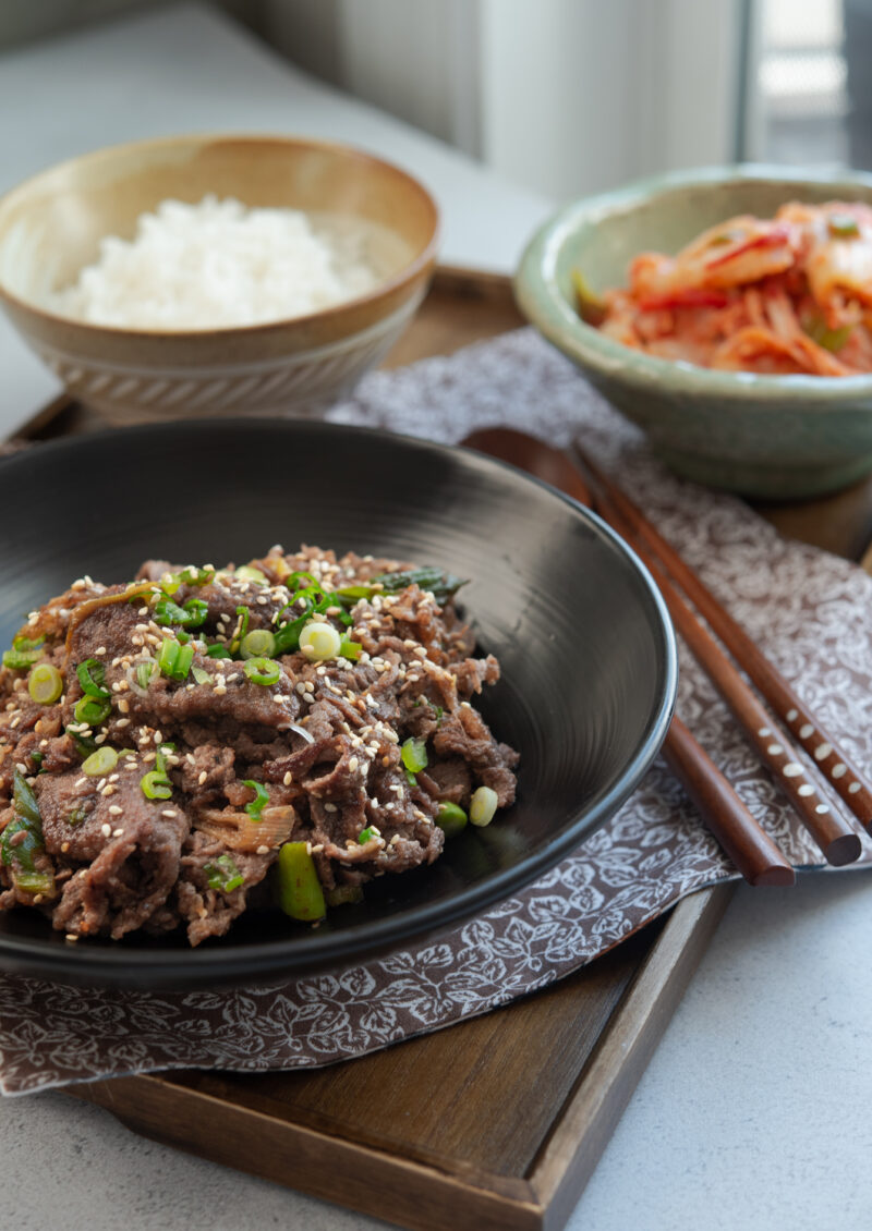 Korean beef bulgogi served with rice and kimchi.