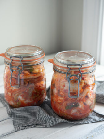 Easy cabbage kimchi (Mak-kimchi) is fermenting in two glass jars