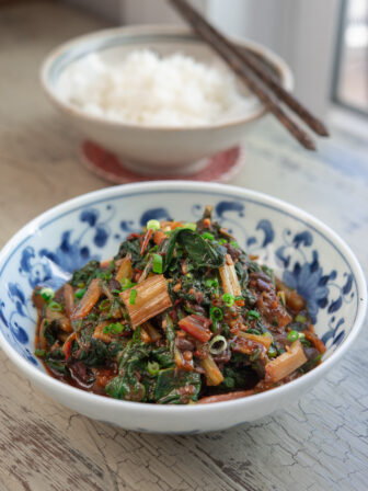Swiss chard is stir-fried with Sichuan chili bean sauce and fermented black beans