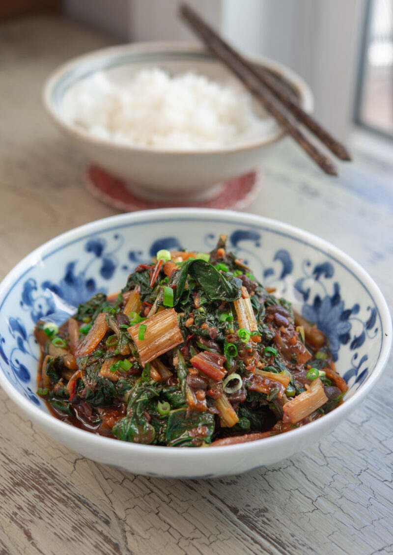 Swiss chard is stir-fried with Sichuan chili bean sauce and fermented black beans.