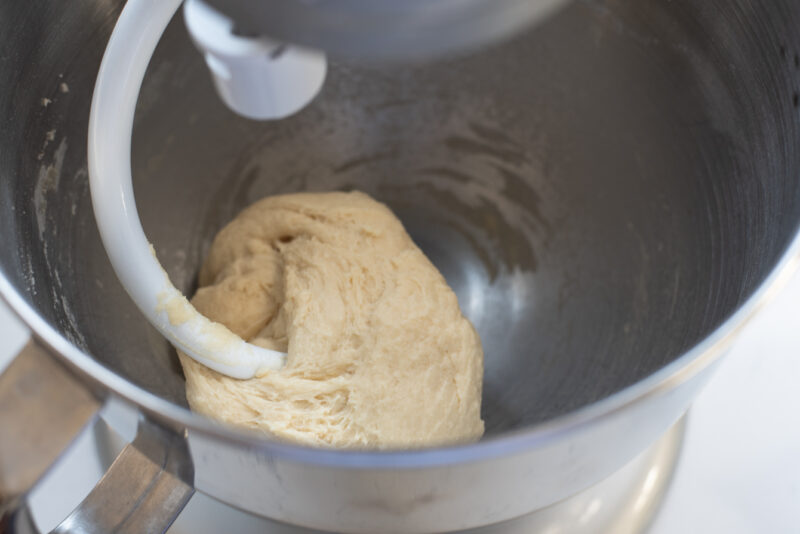  Brioche dough is kneaded in a mixer with a dough hook.