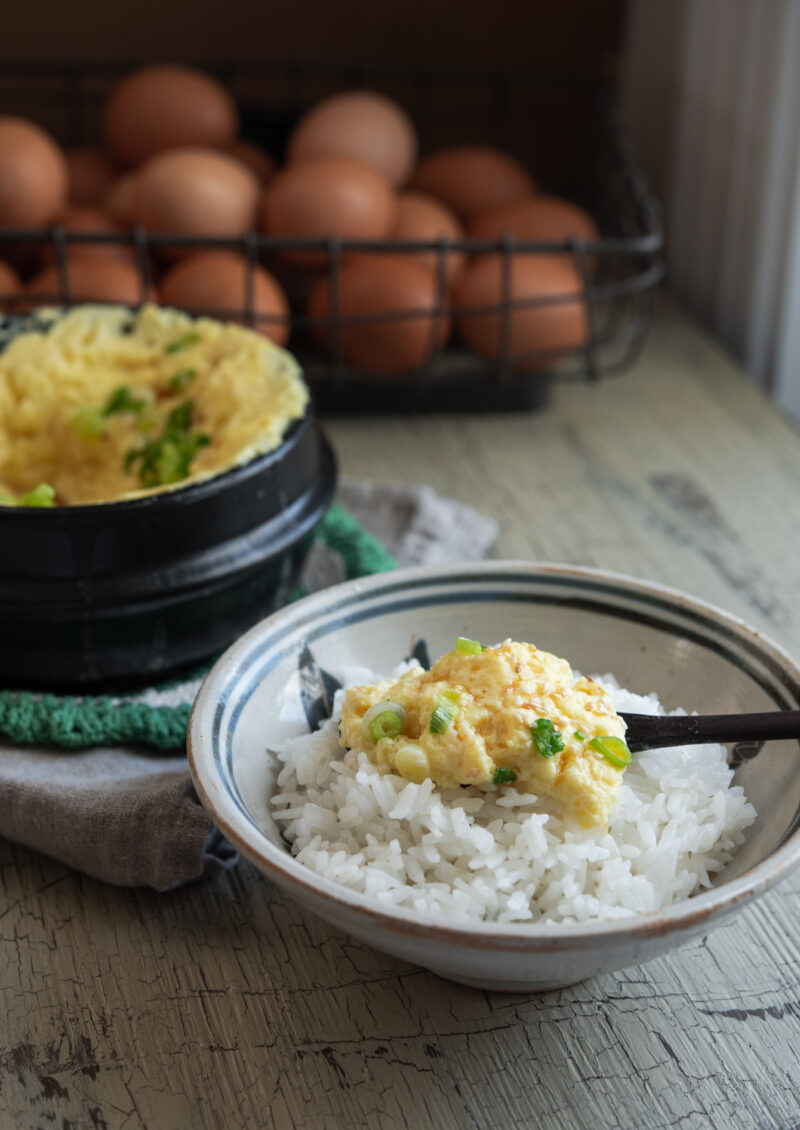 Velvety, fluffy steamed egg served with white rice.