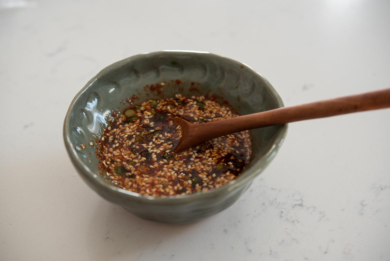 Soy chili sauce mixed in a bowl for topping silken tofu